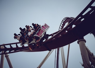 six person riding on roller coaster at daytime