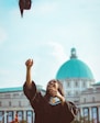 woman throwing her academic hat