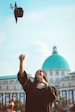 woman throwing her academic hat