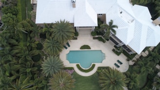 aerial view photography of white house near swimming pool