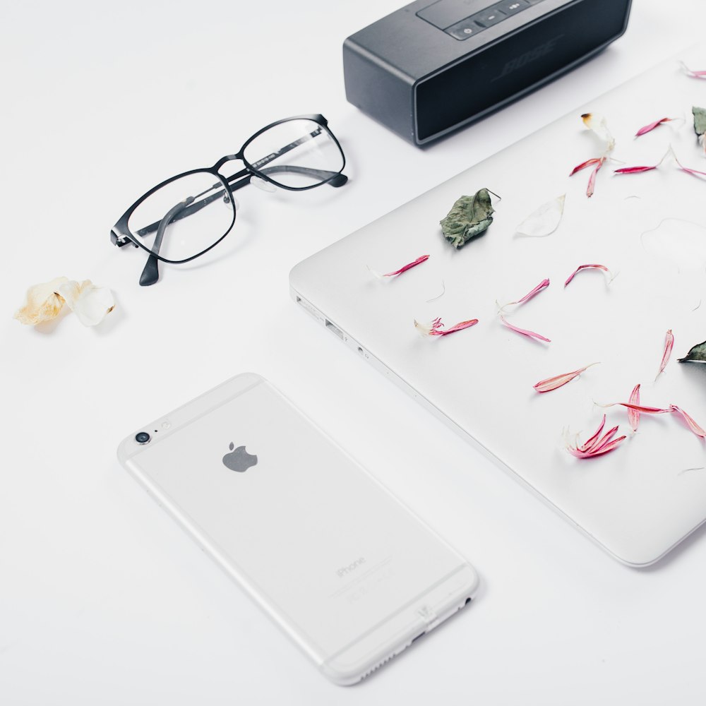 silver iPhone 6 on top of desk