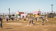 An outdoor festival scene with families enjoying creative games and activities.