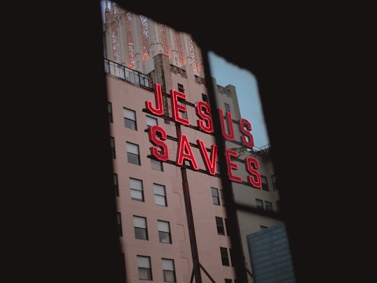Jesus Saves LED signage on concrete building in Downtown United States
