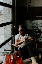 unknown person sitting on brown armchair indoors