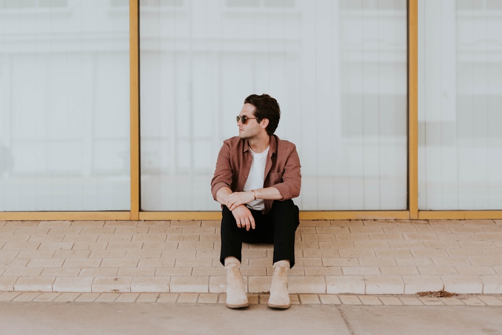 man sitting beside the window