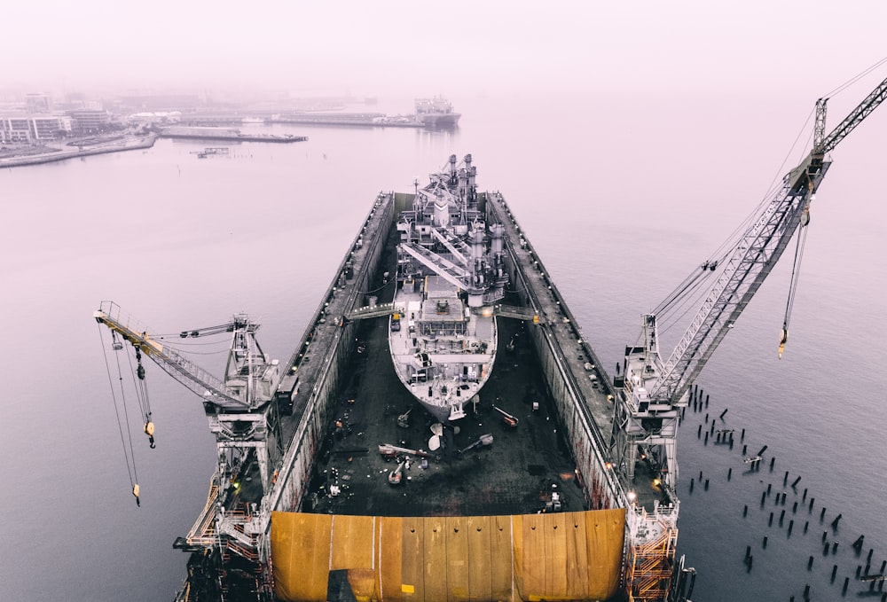 photo of ship on inside oil rig