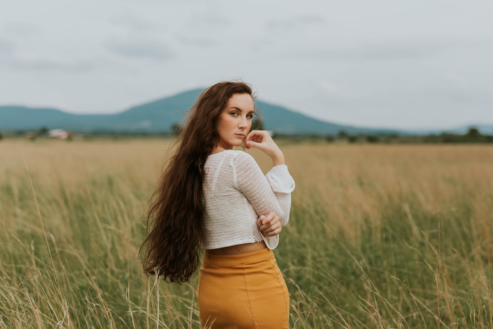 woman standing on grass field