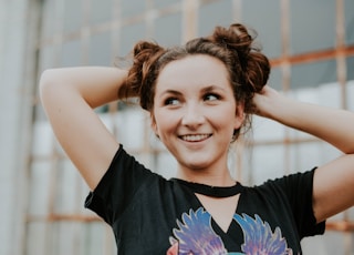 woman wearing black V-neck T-shirt during daytime