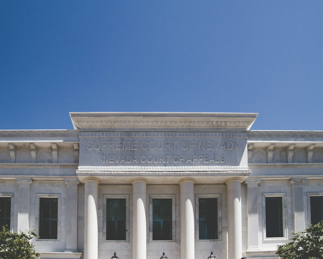 Pale columns frame the entrance to the Supreme Court of Nevada