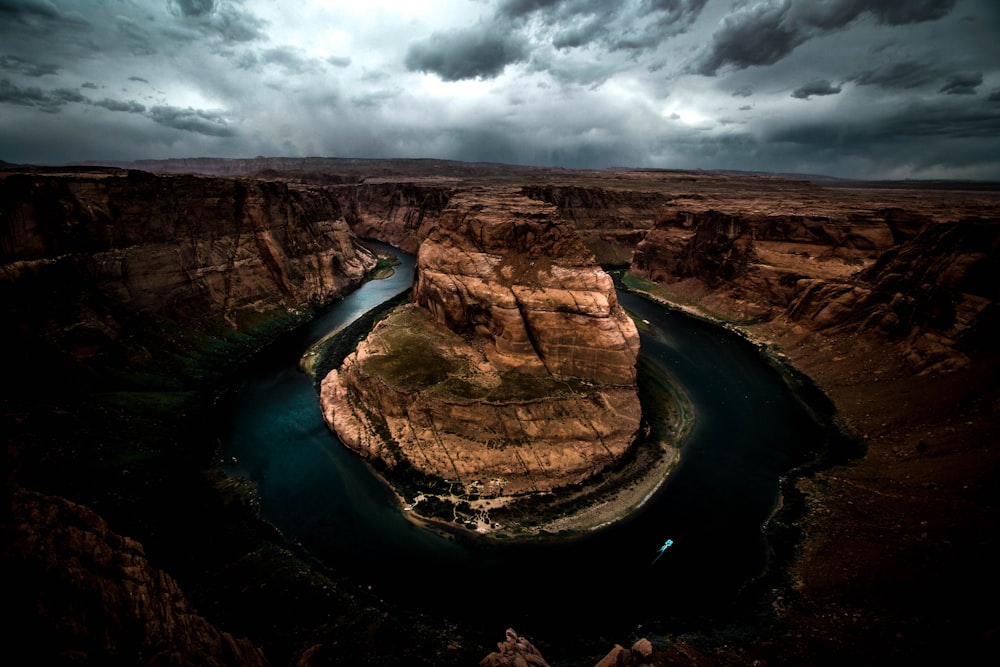 aerial view photography of river near rock mountain