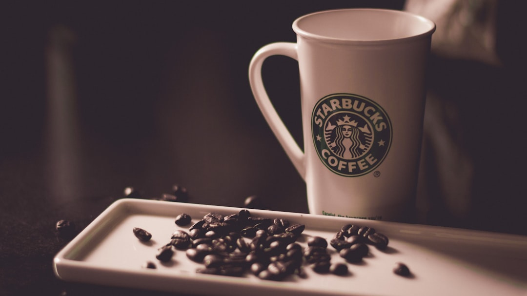 coffee beans beside Starbucks coffee mug, Morning Coffee