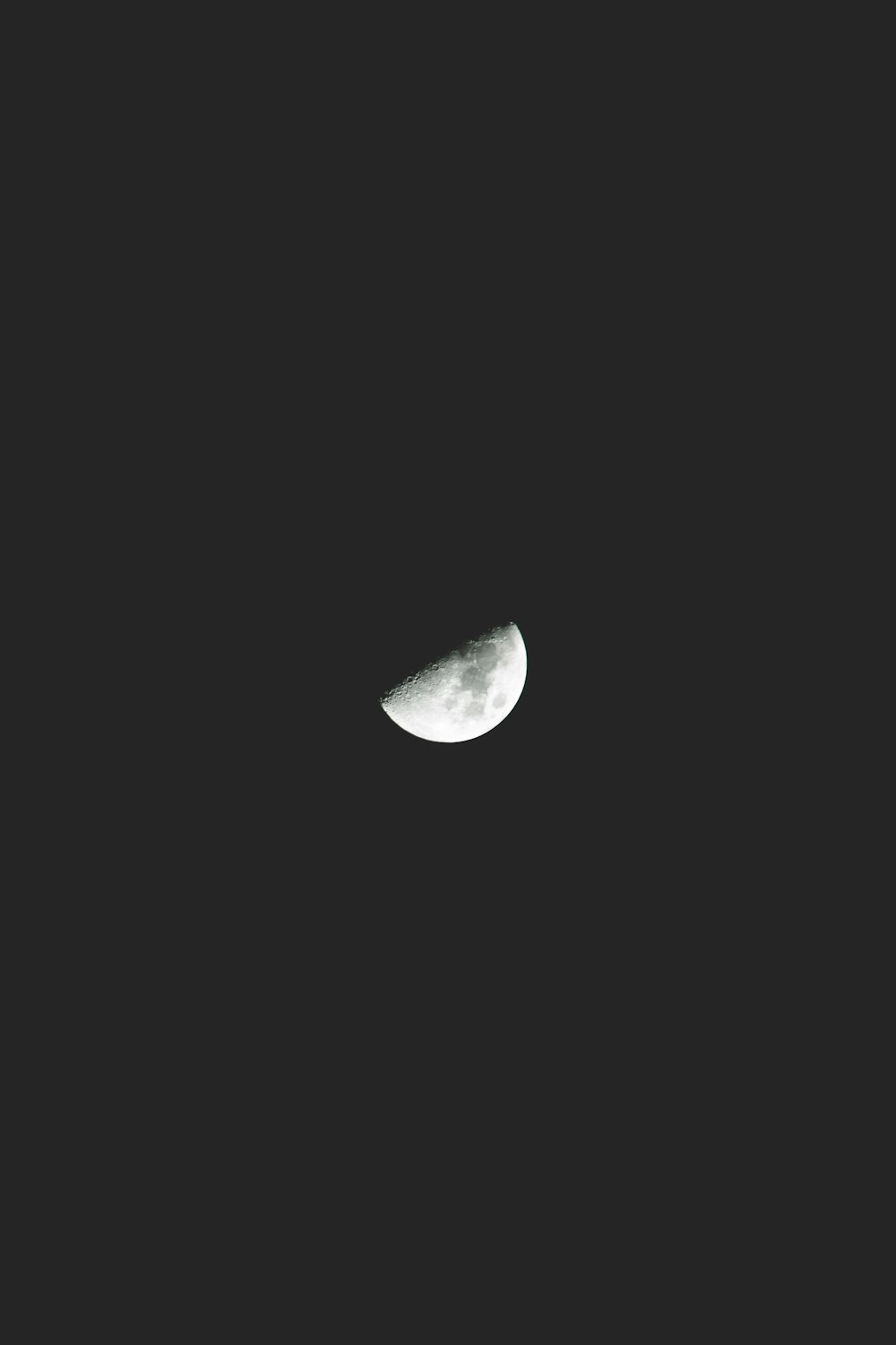 half moon against black background