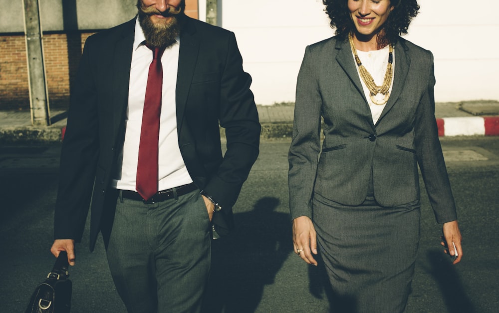 man and woman in formal suit standing beside each other