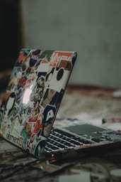 black and white laptop on floor