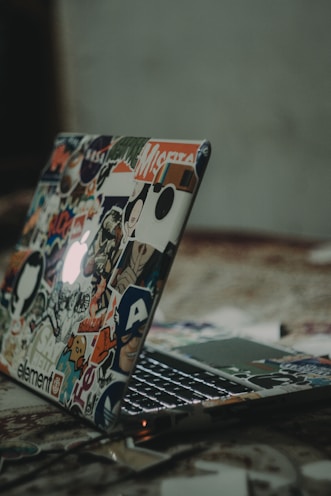 black and white laptop on floor