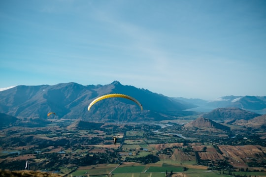 bird's-eye view photography of person in parachute in Queenstown New Zealand