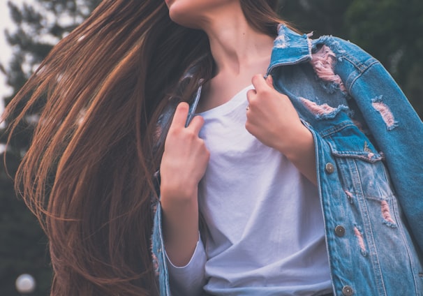 woman holding her white shirt flipping hair