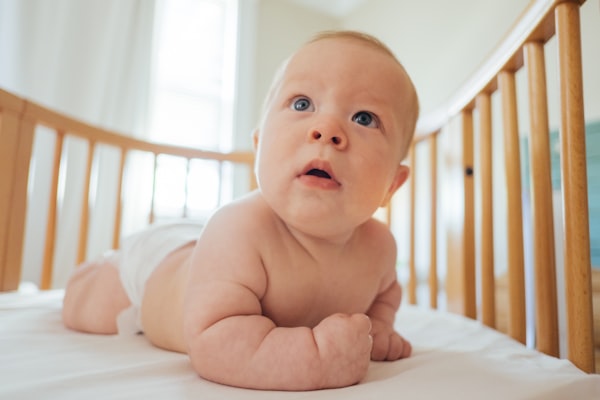 cute baby, baby with rolls, baby with big eyes, baby in crib