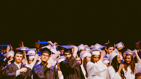 high school graduation with students in cap and gown