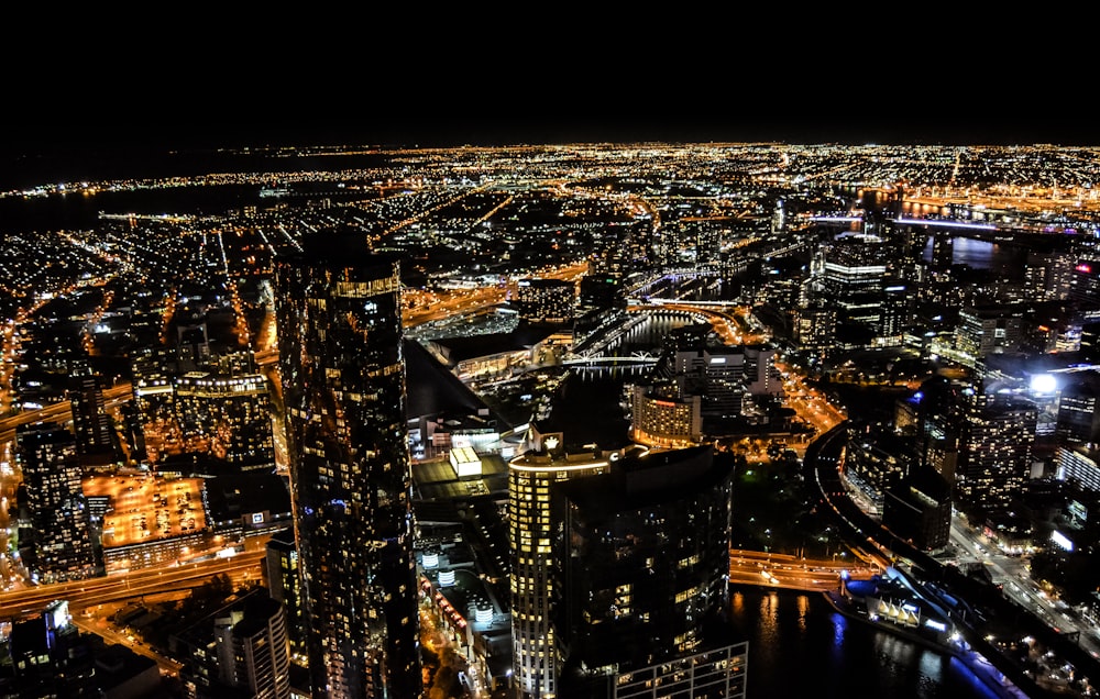 aerial photography of skyscraper at night time