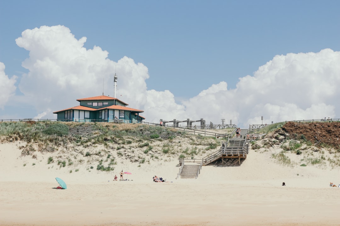 gray house under white clouds, Beachfront property