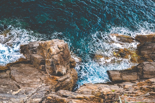 ocean waves crashing rocks in Cinque Terre National Park Italy