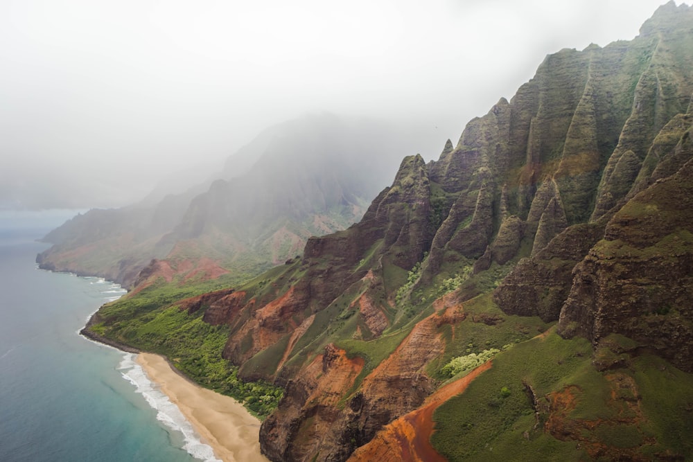 mountain beside body of water