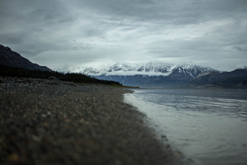 landscape photography of mountains and body of water