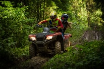Man and woman riding an ATV together on Rab island