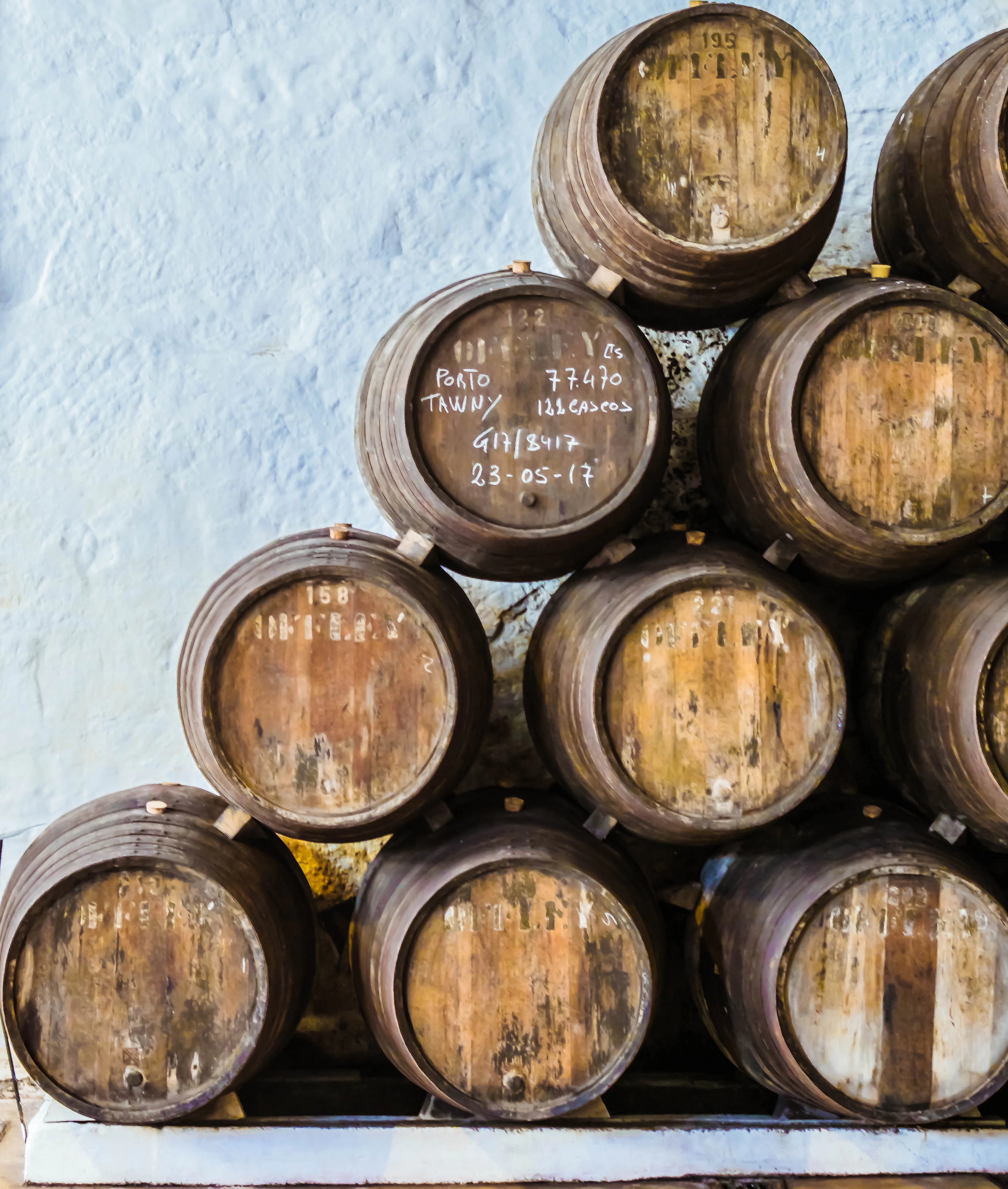 Stacked port wine barrels in a Vila Nova de Gaia cellar
