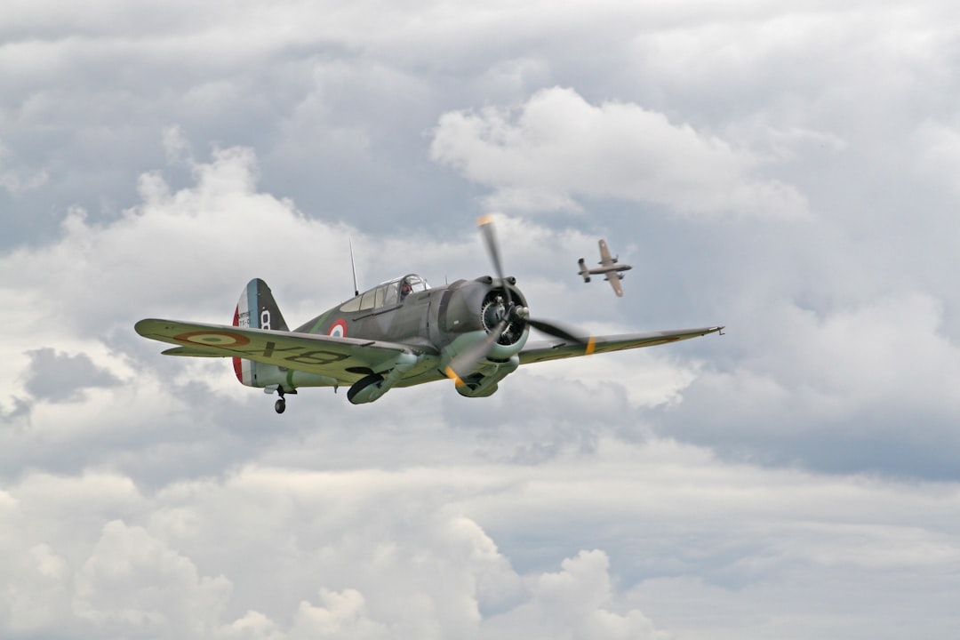 black fighter jet flew in mid air, The P-36 was used most extensively and successfully by the French Armee de l’air duri
