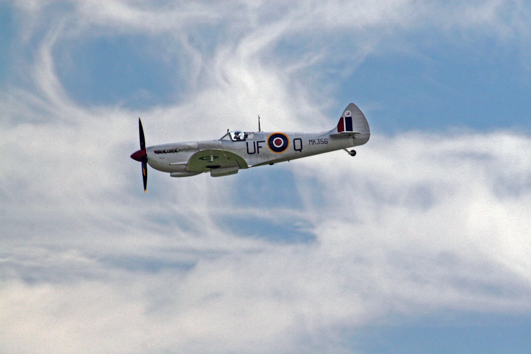 white and black UFO plane under blue sky at daytime, Spitfire Patrol