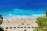 group of people swimming on beach