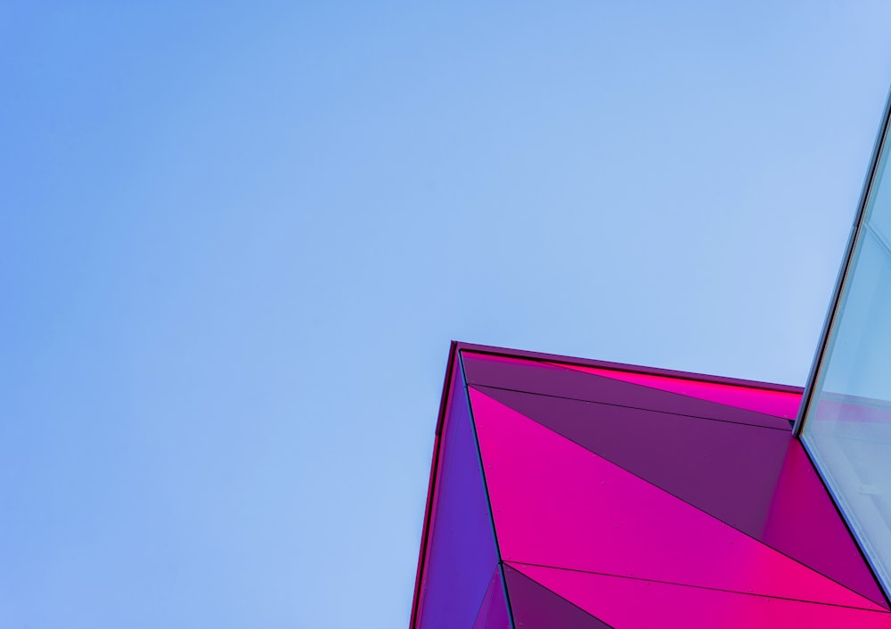 a colorful building with a blue sky in the background