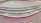 Colorful chalk messages on concrete steps convey sentiments like 'Humans teach here,' 'Humans study here,' 'Humans live here,' and 'Humans love here.' The steps are neatly aligned in a semi-circle pattern, with each message written in different colors.