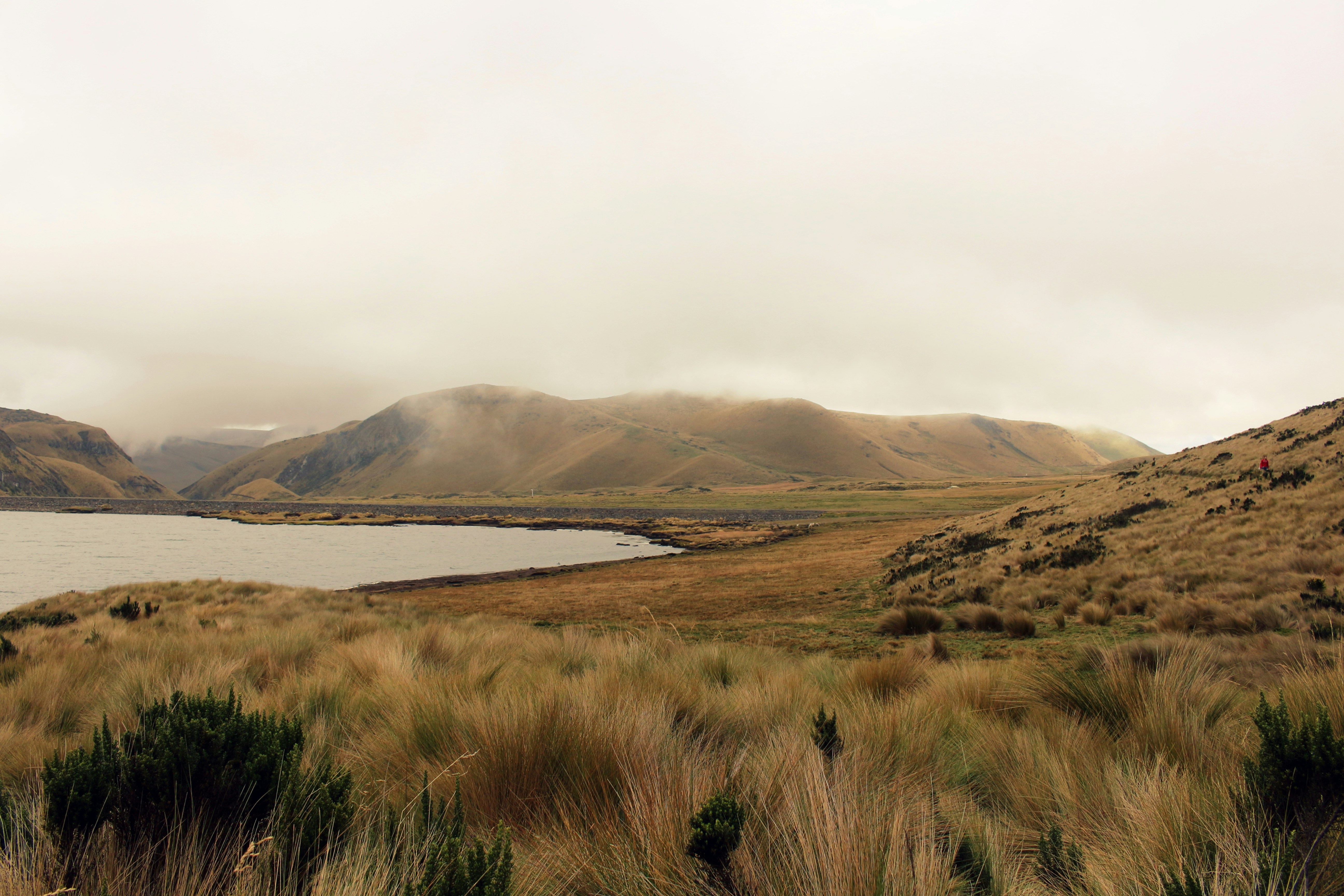 low-angle of mountains near body of water