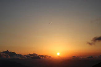 A dramatic aerial shot at sunset overlooking Antigua’s coastline with a Chaso Media drone capturing the scene.