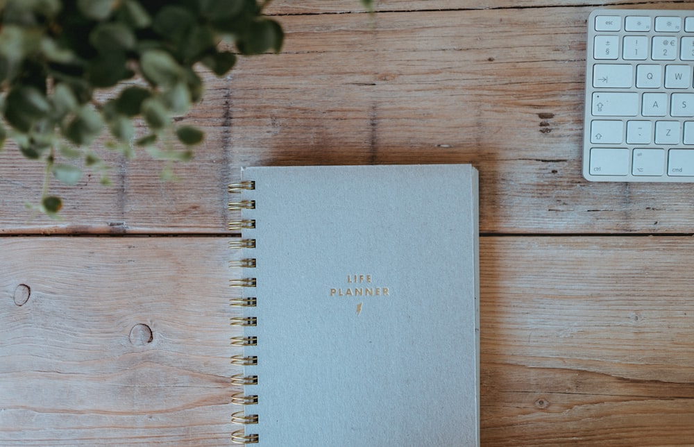 gray notebook on wood