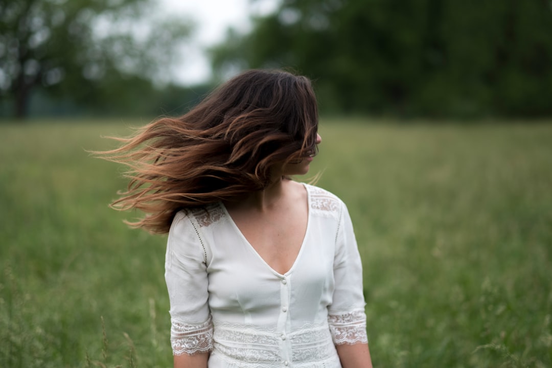 woman standing in grass field