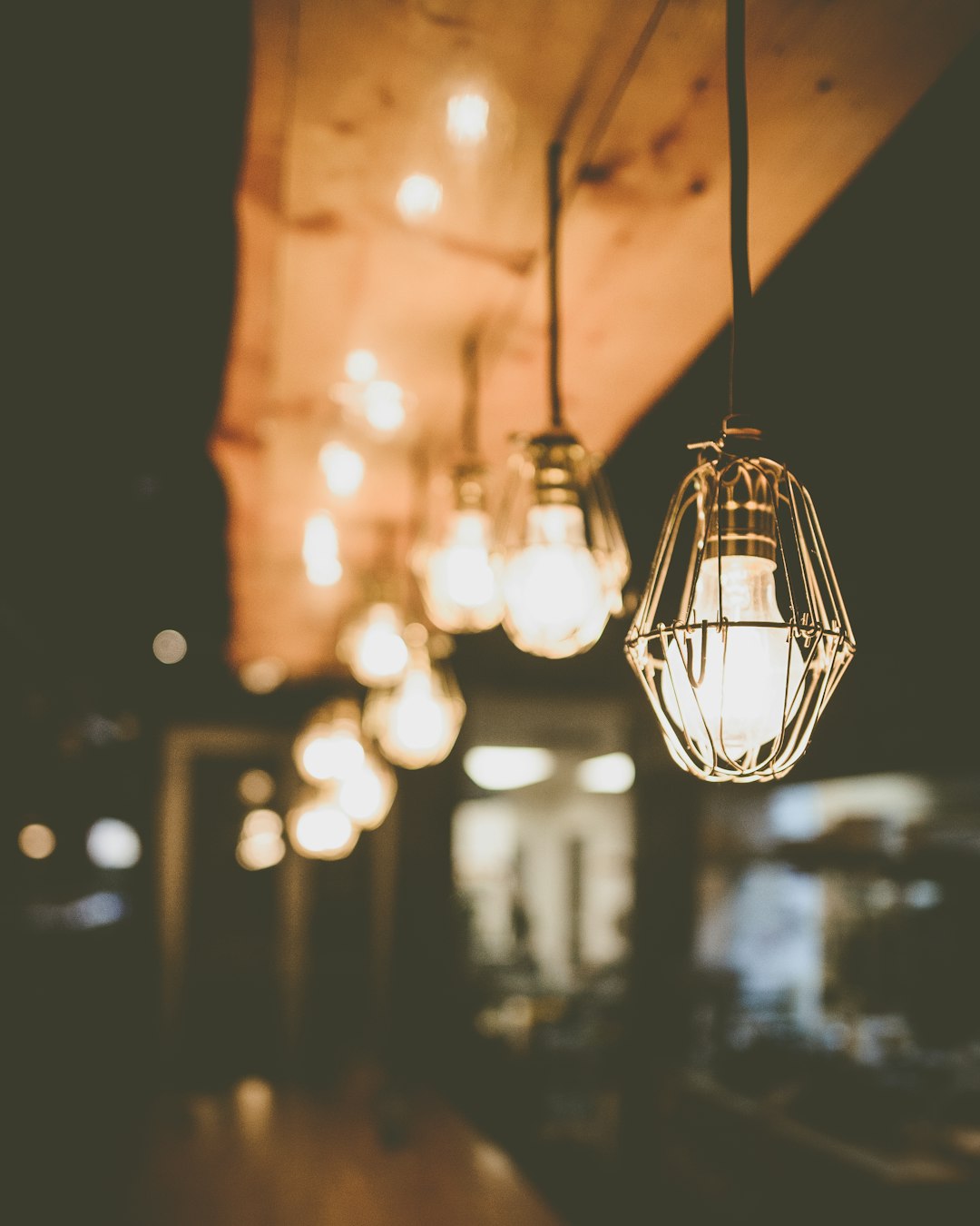 Light fixture installation with hanging light bulbs.