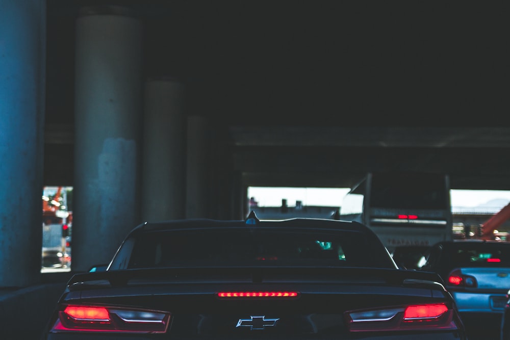 a couple of cars that are sitting in the street