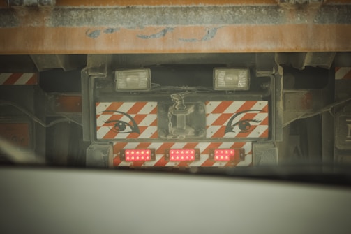 A close-up of a Zyro ELD device installed on a truck dashboard, glowing softly in the early morning light.