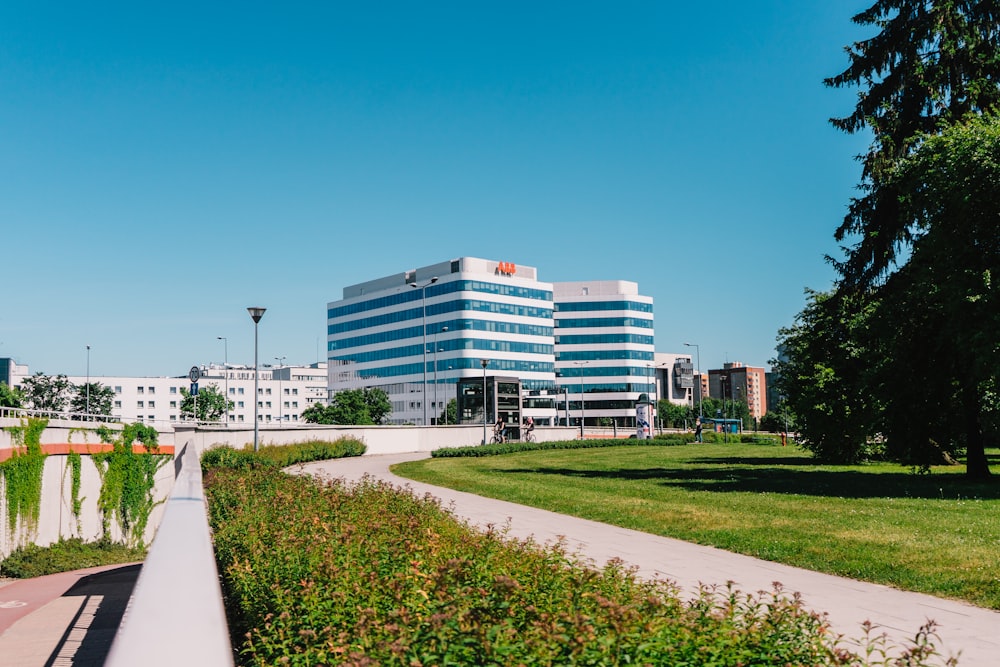 white concrete building near green grass field during daytime