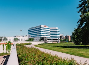 white concrete building near green grass field during daytime