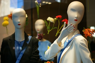 A modern outfit display on a mannequin with chic accessories in a black, white, and purple themed room.