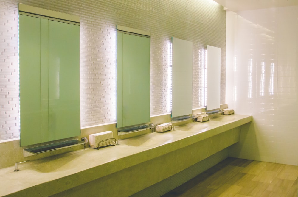 a row of sinks in a public restroom