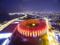 A beautiful view of the stadium lit up at night.