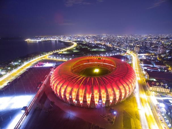 A panoramic view of a stadium lit up at night, perfect for streaming live events.