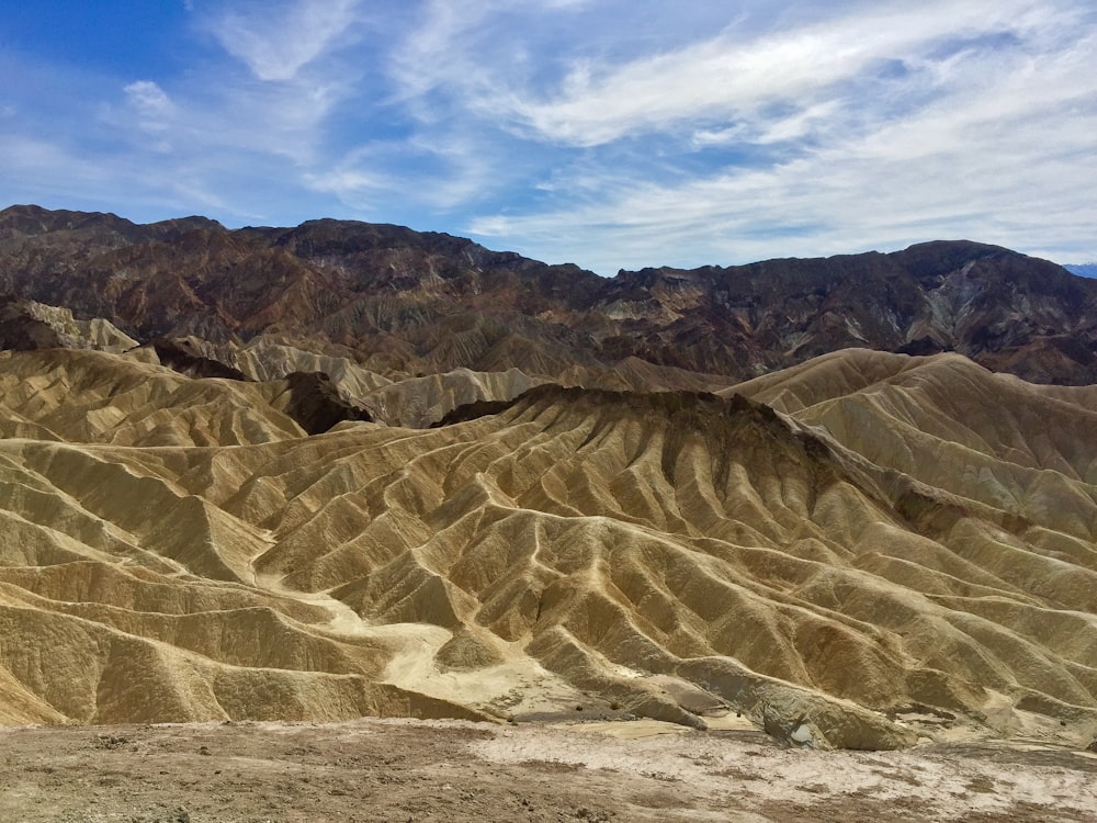 brown rocky mountain under blue sky during daytime