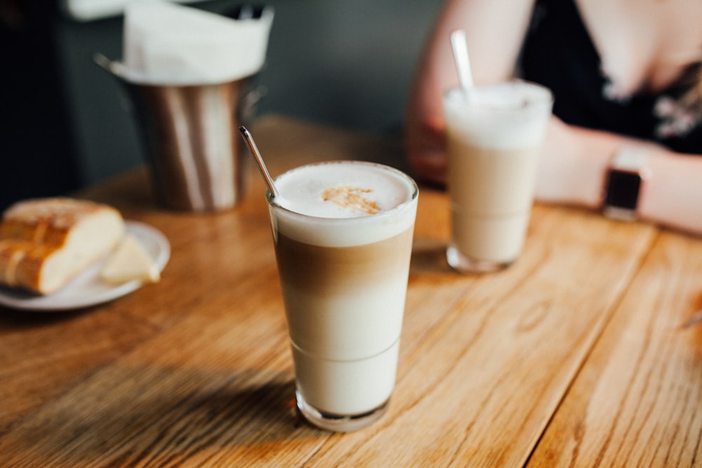 two glass of beverage on table